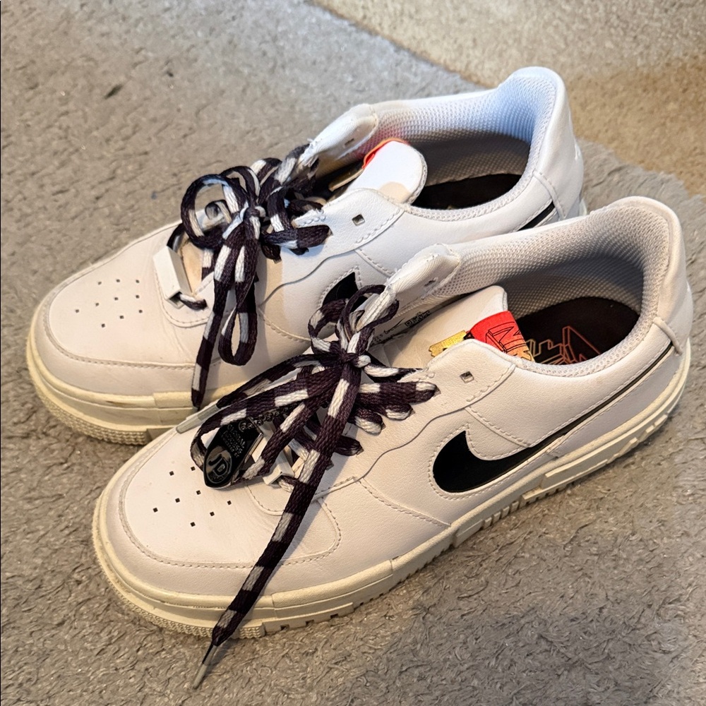 Nike White Sneakers with Black Swoosh and Multicolor Tongue Accents